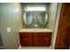 A bathroom features a dual sink vanity with modern fixtures, complemented by sleek mosaic tile accents at 5116 W County Road 450 S, Coatesville, IN 46121