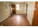 Spacious bedroom featuring wood flooring, a window for natural light, and neutral paint at 5116 W County Road 450 S, Coatesville, IN 46121