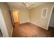 Bedroom with wood laminate flooring, neutral walls, and a ceiling fan for added comfort at 5116 W County Road 450 S, Coatesville, IN 46121