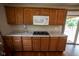 Bright kitchen featuring ample cabinetry, countertops, and modern appliances at 5116 W County Road 450 S, Coatesville, IN 46121