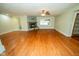 Spacious living area featuring hardwood flooring, fireplace, and abundant natural light at 5116 W County Road 450 S, Coatesville, IN 46121