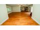 A spacious living room showcases the flowing floor plan and hardwood floors at 5116 W County Road 450 S, Coatesville, IN 46121