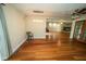 An open living room features a ceiling fan, pendant lighting and wood flooring throughout at 5116 W County Road 450 S, Coatesville, IN 46121