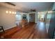 An open-concept living room leads to the fireplace and into the kitchen at 5116 W County Road 450 S, Coatesville, IN 46121