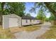 A charming backyard includes a storage shed and freshly mulched garden space enhancing appeal at 5136 Miller St, Indianapolis, IN 46241