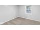 Carpeted bedroom with one window and base trim at 5136 Miller St, Indianapolis, IN 46241