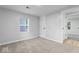 Bedroom with window, closet, and carpeted floor at 5136 Miller St, Indianapolis, IN 46241