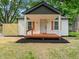 Charming home featuring a quaint front porch and lovely light-colored exterior at 5136 Miller St, Indianapolis, IN 46241