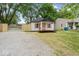 Charming home featuring a quaint front porch and lovely light-colored exterior at 5136 Miller St, Indianapolis, IN 46241