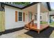 Home featuring a quaint front porch and lovely light-colored exterior at 5136 Miller St, Indianapolis, IN 46241