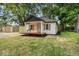 Quaint home showcasing a cozy front porch and nice yard at 5136 Miller St, Indianapolis, IN 46241
