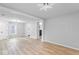 Open-concept living area featuring beautiful floors, neutral paint, and recessed lighting at 5136 Miller St, Indianapolis, IN 46241