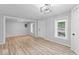 Open-concept living area featuring beautiful floors, neutral paint, recessed lighting and lots of windows at 5136 Miller St, Indianapolis, IN 46241