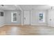 Bright living room featuring beautiful floors and lots of windows at 5136 Miller St, Indianapolis, IN 46241