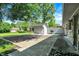 View of a backyard featuring a shed with a BBQ grill and concrete patio at 5236 Daniel Dr, Indianapolis, IN 46226