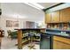 Cozy basement bar features a bar with seating, bottle storage, sink, and refrigerator at 5236 Daniel Dr, Indianapolis, IN 46226