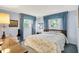 Comfortable bedroom with large windows, cozy carpet, natural light and blue curtains at 5236 Daniel Dr, Indianapolis, IN 46226