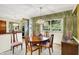 Formal dining area with wood table, upholstered chairs, and bright window view at 5236 Daniel Dr, Indianapolis, IN 46226