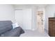 Bedroom featuring carpet, neutral walls and double-door closet at 5335 Rum Cherry Way, Indianapolis, IN 46237