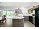 Spacious kitchen with island and stainless-steel appliances and an eat-in kitchen area at 5335 Rum Cherry Way, Indianapolis, IN 46237