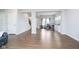 Open-concept living room with modern flooring, connecting seamlessly to other living spaces at 5335 Rum Cherry Way, Indianapolis, IN 46237