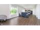 Relaxing living room with backyard views, sleek floors, and comfortable seating with convenient access to kitchen at 5335 Rum Cherry Way, Indianapolis, IN 46237