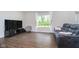 Comfortable living room showcasing sleek flooring and abundant natural light with casual contemporary decor at 5335 Rum Cherry Way, Indianapolis, IN 46237