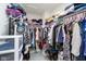 Bright walk-in closet featuring an organized storage system with clothing racks and shelves for ample space at 5335 Rum Cherry Way, Indianapolis, IN 46237
