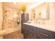 Modern bathroom featuring a glass-enclosed shower, stylish vanity, and elegant fixtures at 5352 Steinmeier N Dr, Indianapolis, IN 46220