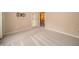 Empty bedroom with ample space, fresh carpet, and a wall-mounted TV bracket installed at 5352 Steinmeier N Dr, Indianapolis, IN 46220