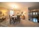 Bright dining room with chandelier, and a convenient pass-through to the kitchen at 5352 Steinmeier N Dr, Indianapolis, IN 46220
