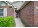 Close-up of the front entrance, showcasing brickwork and covered entryway at 5352 Steinmeier N Dr, Indianapolis, IN 46220