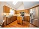 Charming kitchen featuring stainless steel appliances, wooden cabinets, and an island at 5352 Steinmeier N Dr, Indianapolis, IN 46220