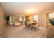 Spacious living room with cozy dining area, neutral tones, and ample natural light at 5352 Steinmeier N Dr, Indianapolis, IN 46220
