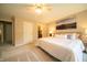 Spacious main bedroom with neutral decor, plush carpeting, and ensuite bathroom access at 5352 Steinmeier N Dr, Indianapolis, IN 46220