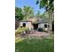 Charming brick patio with an outdoor seating area, grill, and pergola, perfect for entertaining at 5677 Carrollton Ave, Indianapolis, IN 46220
