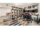 Spacious basement features an open layout, built-in shelving, and a dedicated workspace, perfect for a home office or hobby area at 5677 Carrollton Ave, Indianapolis, IN 46220