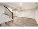 Finished basement with neutral paint, recessed lights and two doors to additional storage at 5677 Carrollton Ave, Indianapolis, IN 46220