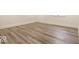 Spacious basement with plank flooring, white trim, and neutral paint at 5677 Carrollton Ave, Indianapolis, IN 46220
