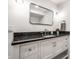 Modern bathroom with sleek vanity, stylish mirror, and elegant fixtures, designed for comfort and sophistication at 5677 Carrollton Ave, Indianapolis, IN 46220