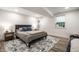 Bedroom features a comfortable bed, stylish decor, and ample natural light, creating a cozy and inviting personal space at 5677 Carrollton Ave, Indianapolis, IN 46220