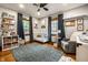 Bright Bedroom with hardwood floors, a gray rug, and charming decor at 5677 Carrollton Ave, Indianapolis, IN 46220