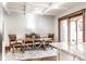 Bright dining room featuring a wooden table, chairs, and an area rug beneath a decorative ceiling at 5677 Carrollton Ave, Indianapolis, IN 46220