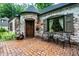 Inviting brick patio with seating and front door at 5677 Carrollton Ave, Indianapolis, IN 46220