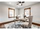 Cozy home office with two windows, a desk, and comfortable seating for a productive work environment at 5677 Carrollton Ave, Indianapolis, IN 46220