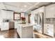 Modern kitchen with stainless steel appliances, center island, and custom cabinetry at 5677 Carrollton Ave, Indianapolis, IN 46220