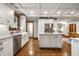 Bright, open-concept kitchen with a center island and stainless steel appliances at 5677 Carrollton Ave, Indianapolis, IN 46220