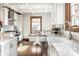Charming kitchen with custom cabinets, farmhouse sink, and breakfast nook at 5677 Carrollton Ave, Indianapolis, IN 46220