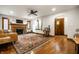 Spacious living room with fireplace, hardwood floors, and natural light at 5677 Carrollton Ave, Indianapolis, IN 46220