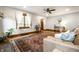 Bright and airy living room featuring hardwood floors, and updated lighting at 5677 Carrollton Ave, Indianapolis, IN 46220